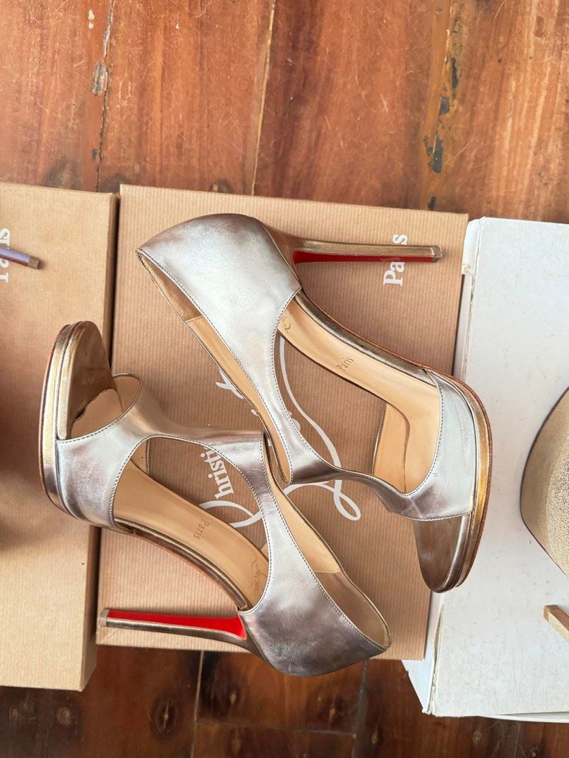 Christian Louboutin Metallic Heels (Category: Heels) located in Cebu City. Submitted by beeurgello (Listing ID 1397794645, Image 3). Description: - Christian Louboutin metallic heels - Features the iconic red sole - Unique T-strap design with open sides - Comes with the original box & dust bags - Perfect for special occasions - same shoes worn by Taylor Swift many years ago.