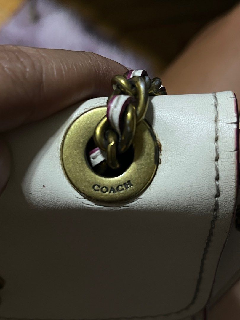 Coach Chain Shoulder Bag (Category: Luxury Bags & Wallets) located in Bulacan. Submitted by sef19 (Listing ID 1397895107, Image 2). Description: - Authentic Coach chain shoulder bag - White exterior - Burgundy interior - Chain strap - Small interior pocket - Made in Vietnam - Floral clasp with Coach logo.