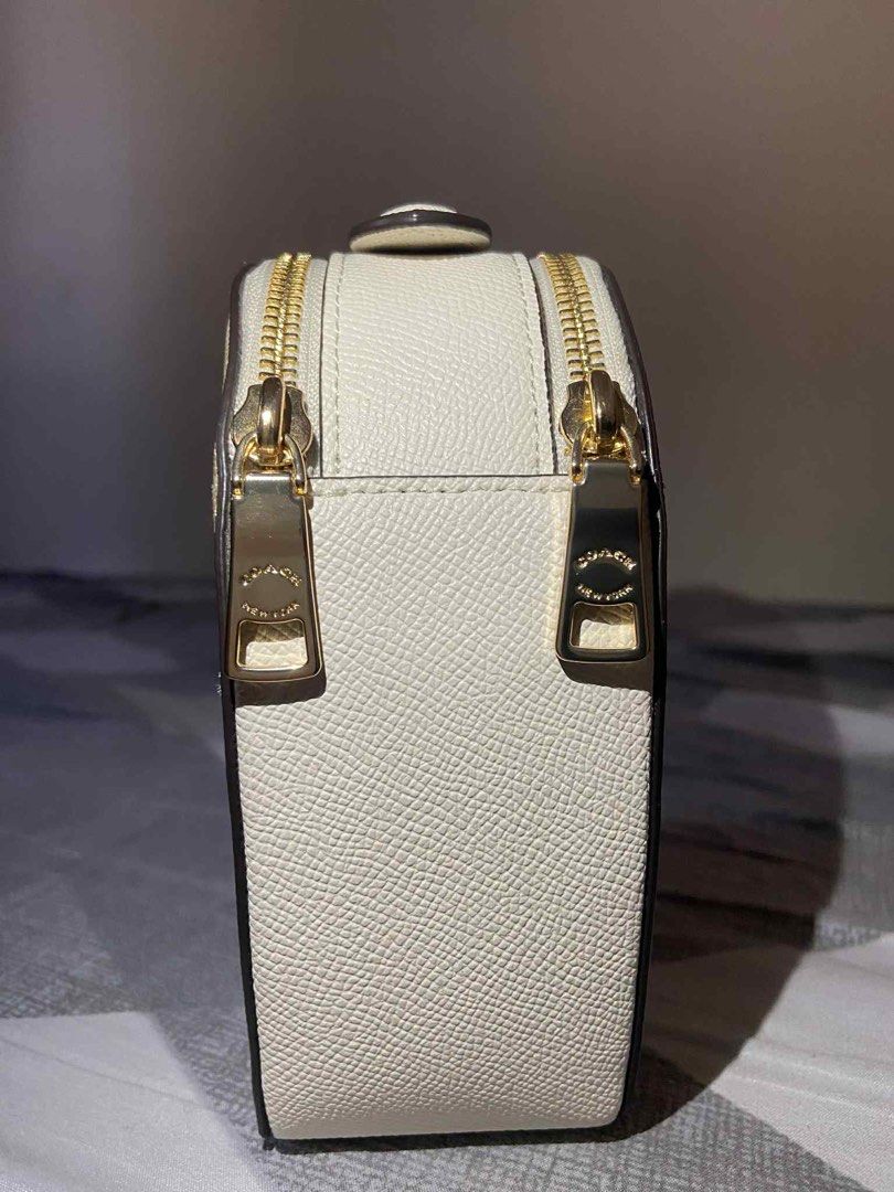 Coach Heart-Shaped Bag (Category: Luxury Bags & Wallets) located in Iba. Submitted by gotmethrift (Listing ID 1397883585, Image 3). Description: - Authentic Coach bag - Unique heart shape - Signature Coach pattern - Top handle - Zip closure - Made in Vietnam - Gold-toned hardware - White trim - Includes Coach tag - Coach interior label.