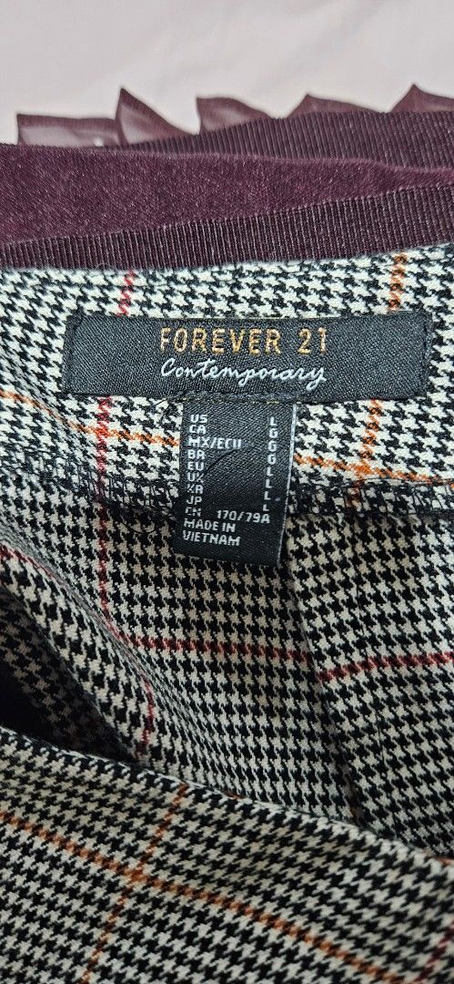 Forever 21 Contemporary Plaid Skirt (Category: Skirts) located in Quezon City. Submitted by technicolorvision (Listing ID 1397923510, Image 3). Description: - RFS: Decluttering - In very good condition; no holes, stains or tears - Plaid pattern - Button details - Two front pockets - Made in Vietnam .
