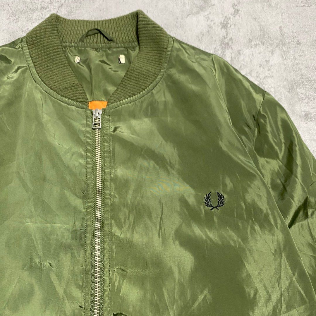 FRED PERRY X JOURNAL STANDARD FLIGHT MA-1 BOMBER JACKET (Category: Coats, Jackets and Outerwear) located in Balanga. Submitted by faded_garmz (Listing ID 1397781567, Image 2). Description: FRED PERRY X JOURNAL STANDARD FLIGHT MA-1 BOMBER JACKET GOOD CONDITION EMBROIDERED FP LOGO YKK ZIP SIZE XL TIGHT RIBBINGS CUT MAIN LABEL DIMENSIONS WIDTH - 23” LENGTH - 28” SHOULDER - 18” SLEEVE - 27” HEM - 17” PRICE: ₱2,820.