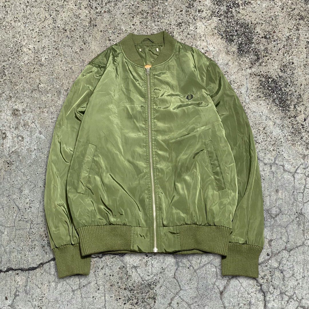 FRED PERRY X JOURNAL STANDARD FLIGHT MA-1 BOMBER JACKET (Category: Coats, Jackets and Outerwear) located in Balanga. Submitted by faded_garmz (Listing ID 1397781567, Image 1). Description: FRED PERRY X JOURNAL STANDARD FLIGHT MA-1 BOMBER JACKET GOOD CONDITION EMBROIDERED FP LOGO YKK ZIP SIZE XL TIGHT RIBBINGS CUT MAIN LABEL DIMENSIONS WIDTH - 23” LENGTH - 28” SHOULDER - 18” SLEEVE - 27” HEM - 17” PRICE: ₱2,820.