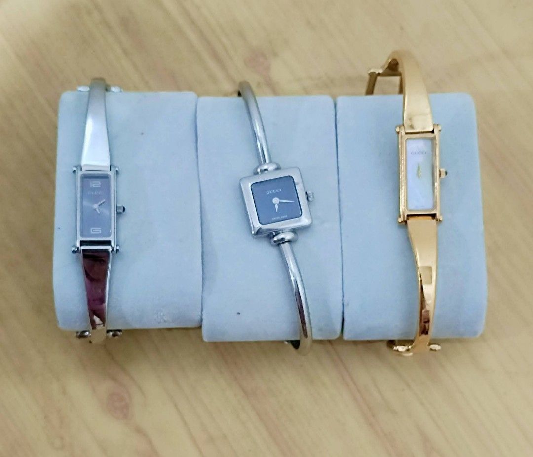 Gucci Bangle Watches (Category: Luxury Watches) located in Quezon City. Submitted by maeclosetph (Listing ID 1397945780, Image 1). Description: - Gucci Bangle Watch Collection: - Watch 1: Rectangular dark face, silver band, burgundy leather strap. - Watch 2: Square dark face, silver band. - Watch 3: Rectangular white face, gold band. Gucci gold-12k Gucci silver-10k Gucci square-8,500.