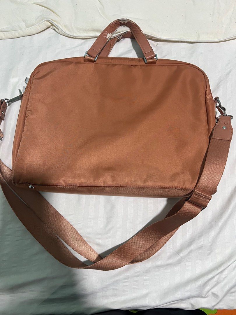 Original Hedgren Laptop Bag (Category: Laptop Bags & Sleeves) located in Taguig. Submitted by miasfinds (Listing ID 1397898454, Image 3). Description: - Original Brown Orange Hedgren laptop bag - Includes a shoulder strap and top handles - Multiple compartments for organization - Padded section for laptop - RFID protected compartment - See photos for flaws. Just the handle. .