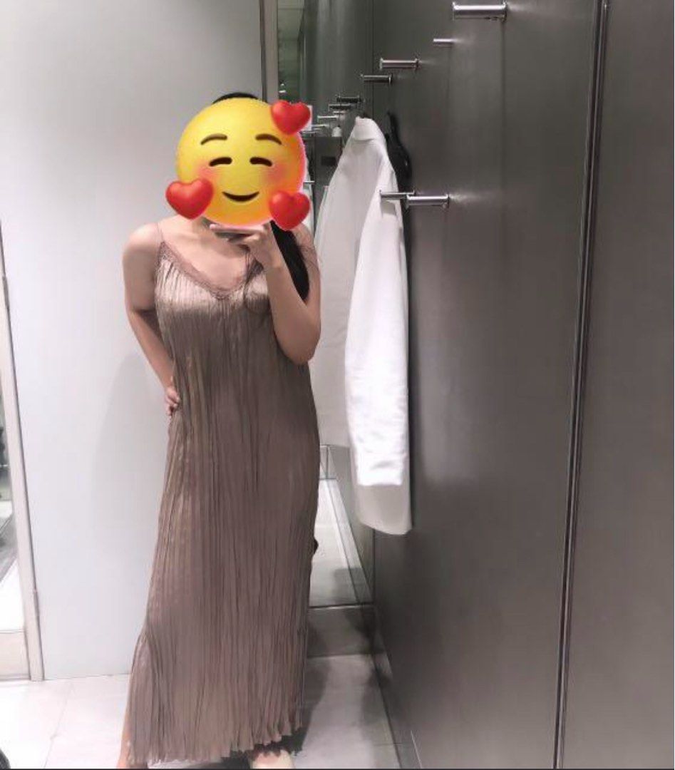 H&M Cami Slip Maxi Dress (Category: Dresses) located in Mandaluyong City. Submitted by dmpsy (Listing ID 1397891446, Image 2). Description: Worn twice for parties Size Reference On Tag: XS but fits up to Medium My height: 5’1 (for reference) Model in photo height 5’10 Material: Polyester 100% Color: Light Greige Straight-cut, calf-length dress in a crinkled weave with narrow, adjustable shoulder straps, a lace-trimmed V-neck and high slits in the