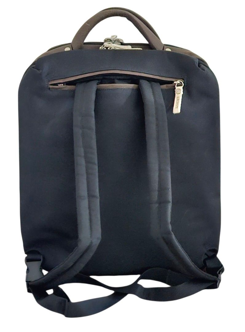 Lacoste 3 way (backpack, sling, tote) (Category: Backpacks) located in Las Pinas. Submitted by 05.11minimalist (Listing ID 1397787875, Image 3). Description: Lacoste backpack, sling & tote bag (3 way). Ballistic nylon. Black/brown. Dimensions: 13.5" length, 16" height, 6.5" width. Laptop sleeve, multiple interior and exterior open and zip pockets. Signed hardware. Very clean interior. No runs, rips or holes. In very good condition. Please do not 