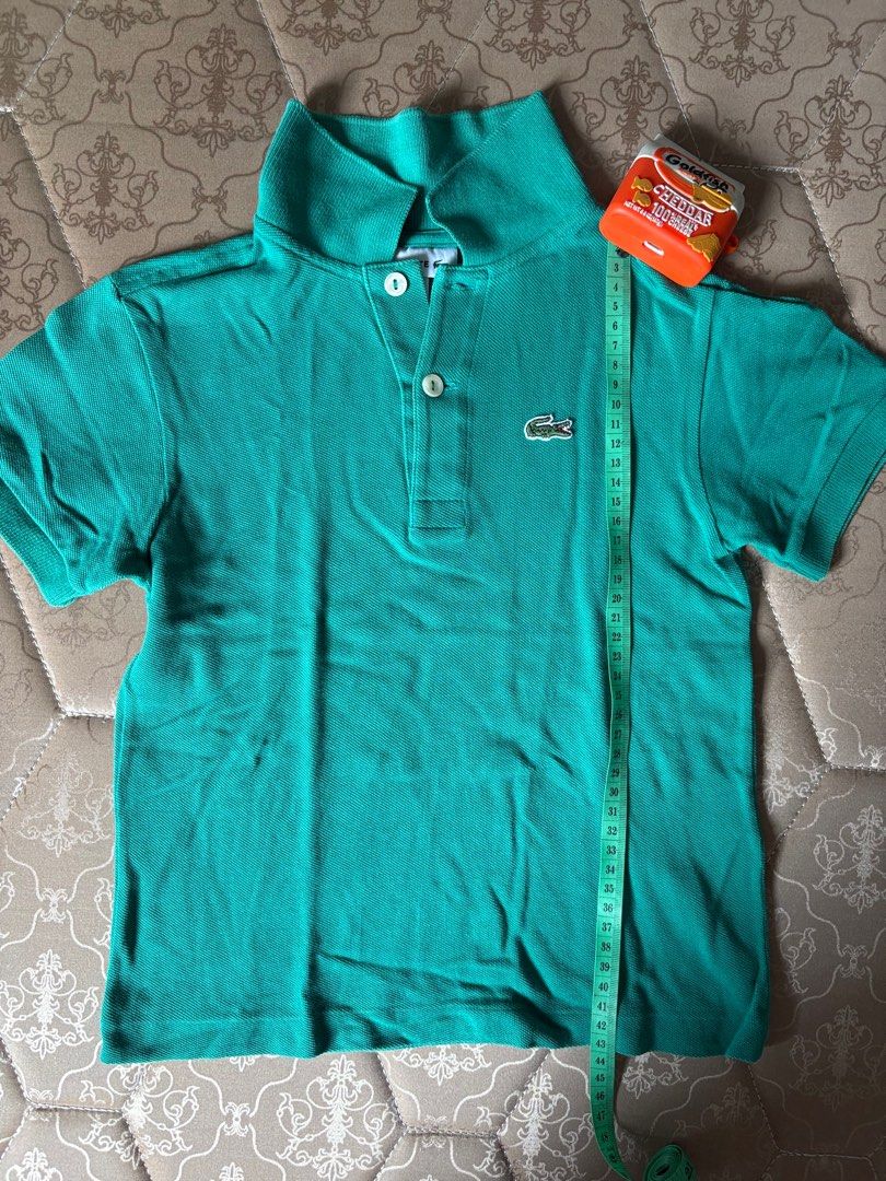 Lacoste Green Polo shirt (Category: Babies & Kids Fashion) located in Marikina City. Submitted by igmtsisters (Listing ID 1397827507, Image 1). Description: Lacoste Green Polo shirt Lightly used P480+SF‼️ 3rd photo is a 6yo for reference Marikina .