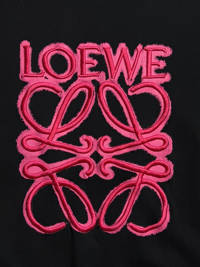 Loewe Embroidered Logo T-shirt (Category: Tshirts & Polo Shirts ) located in Cebu City. Submitted by stylehub_ (Listing ID 1397815440, Image 2). Description: - Black Loewe T-shirt - Best fit: L - Width: 22 - Length: 27.5 - Pink embroidered logo - Crew neck - Short sleeves - Made in Portugal - 100% cotton - Features Loewe logo on neck and front.