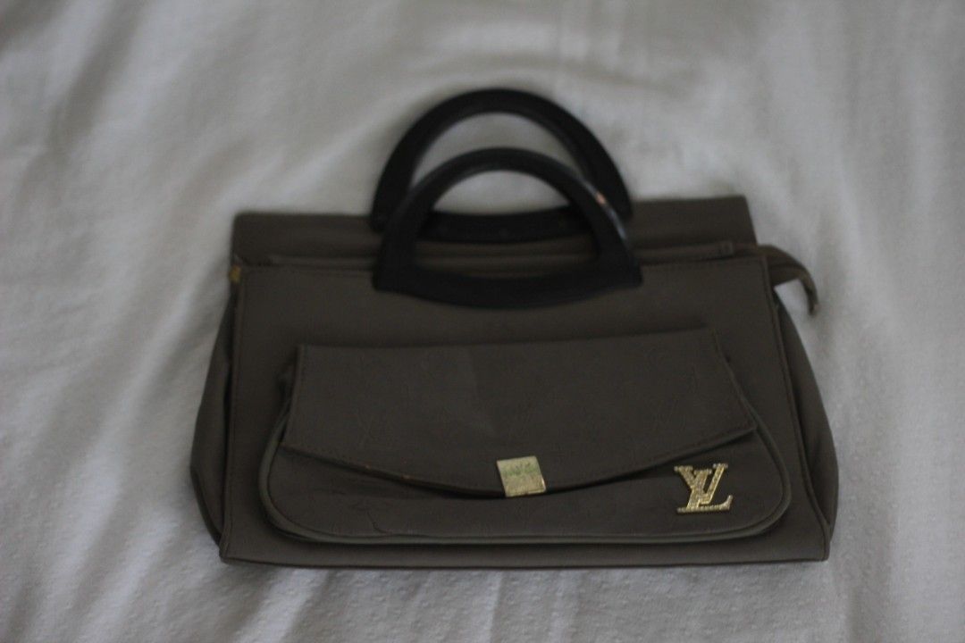 Louis Vuitton Handbag (Category: Luxury Bags & Wallets) located in Imus. Submitted by izzy_homebody (Listing ID 1397791839, Image 1). Description: Gray Louis Vuitton Handbag (Original afaik/gifted from abroad) -all zippers are working -white stains at the back of the bag RFS:Hindi na nagagamit.