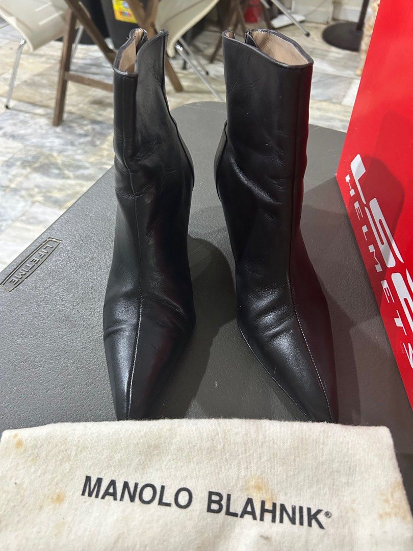 Manolo Blahnik Black Leather Ankle Boots (Category: Boots) located in Manila. Submitted by espcc (Listing ID 1397784975, Image 2). Description: ✨ Manolo Blahnik Black Leather Ankle Boots 👢 Selling my authentic Manolo Blahnik ankle boots — elegant, timeless, and super chic! Made from soft genuine leather with a pointed toe and kitten heel, they’re both stylish and comfortable. 💫 Condition: Gently used, well kept, and still in excellent condition
