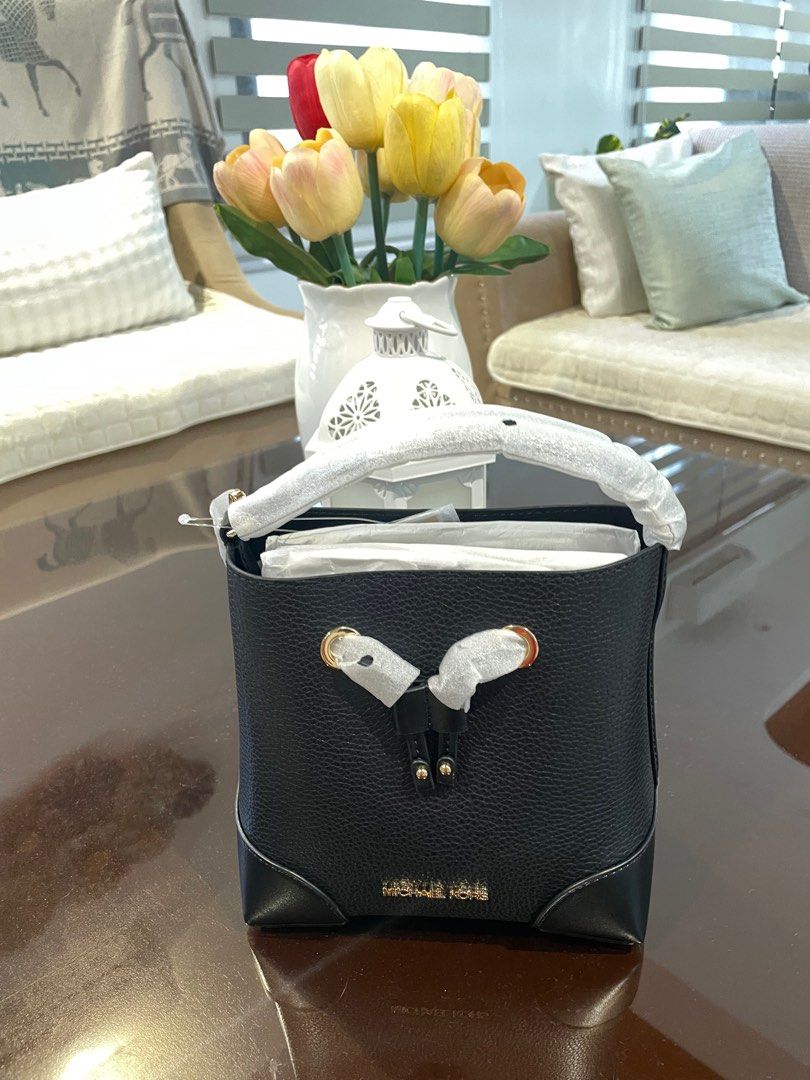 Michael Kors Mercer Small Drawstring Bucket Bag (Category: Luxury Bags & Wallets) located in Manila. Submitted by lukemafinds (Listing ID 1397807258, Image 1). Description: - Authentic Michael Kors Mercer Small Drawstring Bucket Bag - Color: Black - Material: Leather - Hardware: Gold-tone - Features: - Drawstring closure - Top handle - Detachable shoulder strap - Includes: Care card and tags - Design: Michael Kors logo on the front -3299 firm.