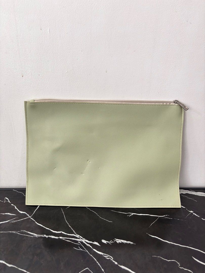 Mint Green Straightforward Laptop Sleeve (Category: Laptop Bags & Sleeves) located in Manila. Submitted by mrldelrosario.1 (Listing ID 1397894716, Image 2). Description: Condition: slight dents outside, ink stain in the front pocket (not seen outside) RFS: Decluttering Mode of Payment: Gcash/Maya Meetup: SM Light (Time depends on availability) Delivery: Lalamove/Grab (Buyer to set up delivery and payment).