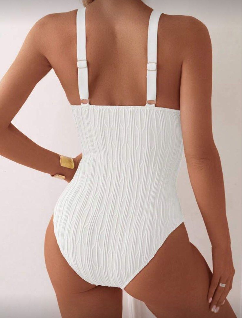 One Piece Strap White Textured Swimsuit (Category: Bikinis & Swimsuits) located in Manila. Submitted by _boxofelle (Listing ID 1397816820, Image 2). Description: - White textured one-piece swimsuit - Features a flattering V-neck - Adjustable straps for a custom fit - Ideal for swimming and beach activities Brand new, never been used Rfs: Not my style.