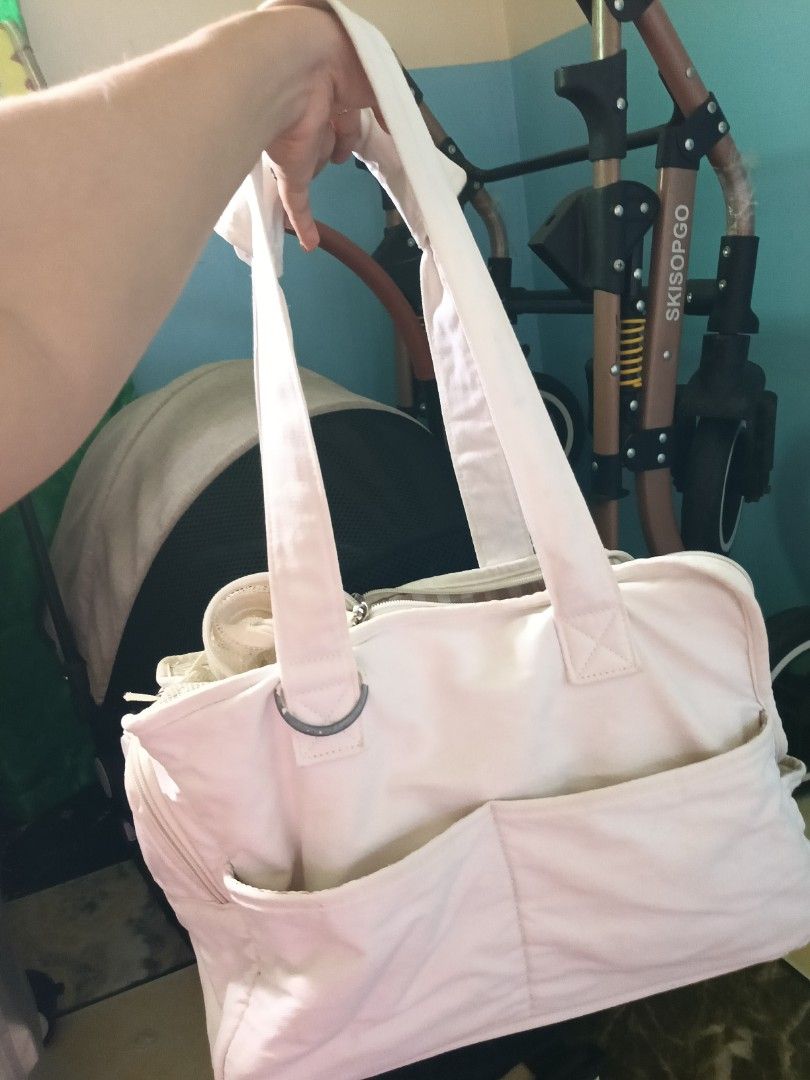 OneCute Pet Carrier Bag (Category: Homes & Other Pet Accessories) located in Daraga. Submitted by declutter.with_me (Listing ID 1397859317, Image 3). Description: Orig price 1,6k+ OneCute pet carrier bag is perfect for small pets. It features a soft cream white exterior with multiple pockets for storage. The bag has a mesh top for ventilation and a comfortable interior. Size: Small Flaw: Tanggal paint sa metal part as shown on photos..