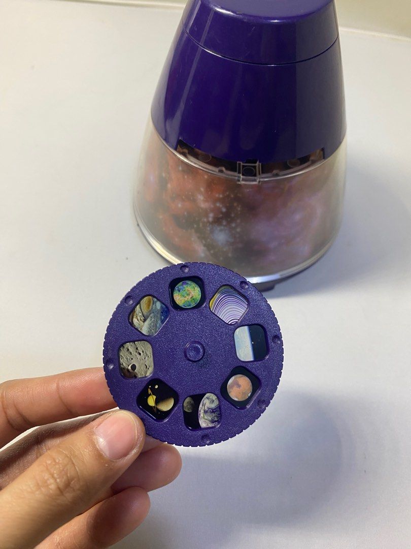 Planetarium Projector (Category: Projectors) located in Pasacao. Submitted by wengpullar37205 (Listing ID 1397939063, Image 2). Description: - Galaxy scene projector - Includes planet slides - Purple color with clear dome - Battery compartment - Made in China Battery operated.