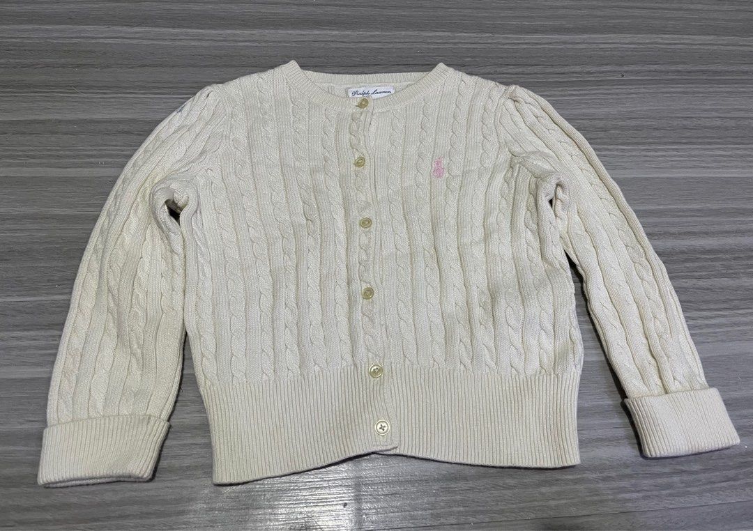 Ralph Lauren Cable Knit Cardigan 24M (Category: Babies & Kids Fashion) located in Manila. Submitted by kenriegab (Listing ID 1397862609, Image 1). Description: - Ralph Lauren cable knit cardigan - Cream color - Size: 24 months - Classic button-down style - Polo logo - Made in Indonesia - Minor stain on sleeve - Perfect for layering Dimes: L 12 x W 12 Excellent condition Minor issue may washable stain sa last pic +shipping.