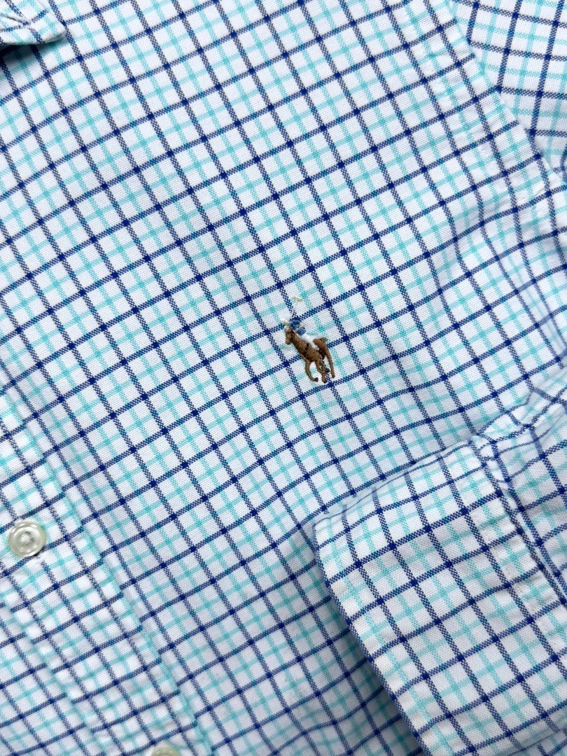 Ralph Lauren Classic Fit Checkered Shirt (Category: Tshirts & Polo Shirts ) located in Cebu City. Submitted by stylehub_ (Listing ID 1397809941, Image 2). Description: - Ralph Lauren Classic Fit shirt - Size: M -Width: 23 -Length 28/29 - Pattern: Blue and white checkered - Features a button-down collar - Embroidered Ralph Lauren logo - Made in the Philippines.