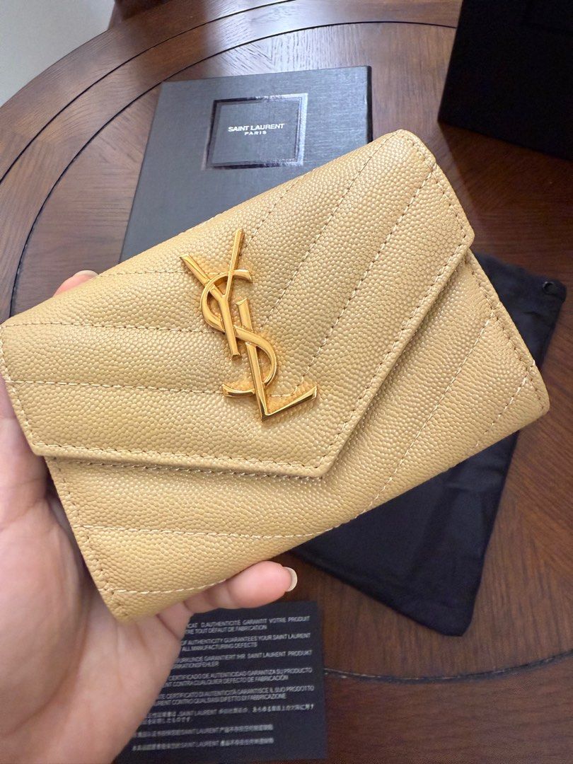 Saint Laurent Monogram Compact Wallet (🇯🇵 Preloved) (Category: Luxury Bags & Wallets) located in Quezon City. Submitted by lavieluxe08 (Listing ID 1397914368, Image 1). Description: Saint Laurent Monogram Compact Wallet – Black Grain de Poudre Leather 🖤✨ Effortlessly elegant, this Saint Laurent Monogram Compact Wallet is crafted in premium grain de poudre leather, known for its rich texture and durability. The iconic YSL logo in silver-tone ha