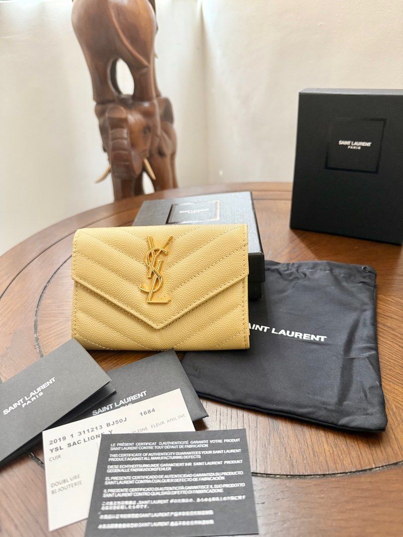 Saint Laurent Monogram Compact Wallet (🇯🇵 Preloved) (Category: Luxury Bags & Wallets) located in Quezon City. Submitted by lavieluxe08 (Listing ID 1397914368, Image 3). Description: Saint Laurent Monogram Compact Wallet – Black Grain de Poudre Leather 🖤✨ Effortlessly elegant, this Saint Laurent Monogram Compact Wallet is crafted in premium grain de poudre leather, known for its rich texture and durability. The iconic YSL logo in silver-tone ha