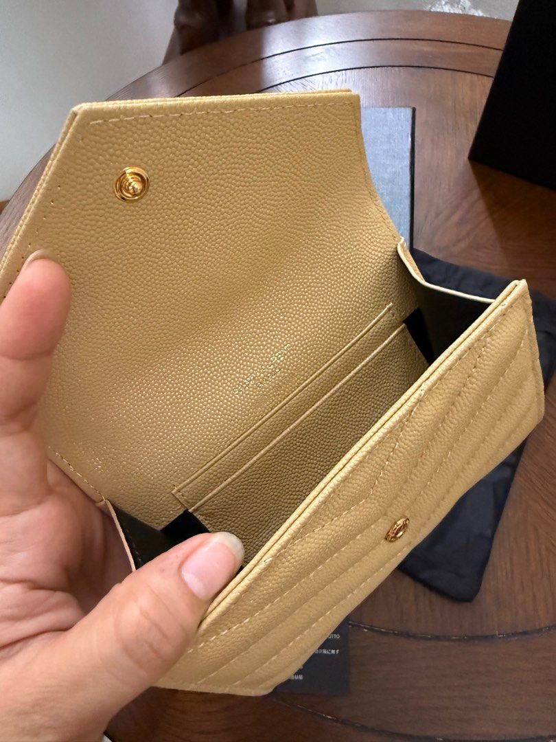 Saint Laurent Monogram Compact Wallet (🇯🇵 Preloved) (Category: Luxury Bags & Wallets) located in Quezon City. Submitted by lavieluxe08 (Listing ID 1397914368, Image 2). Description: Saint Laurent Monogram Compact Wallet – Black Grain de Poudre Leather 🖤✨ Effortlessly elegant, this Saint Laurent Monogram Compact Wallet is crafted in premium grain de poudre leather, known for its rich texture and durability. The iconic YSL logo in silver-tone ha