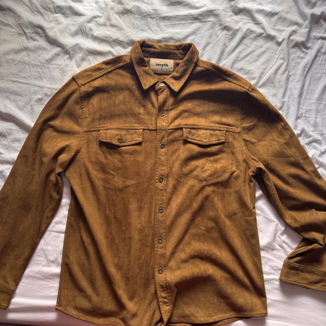 Smyth Suede Shirt | Size M (Category: Tshirts & Polo Shirts ) located in Manila. Submitted by helloitsjan (Listing ID 1397846997, Image 2). Description: - Smyth suede shirt - Warm brown color - Size M - Classic button-down style - Two chest pockets - Collared neckline - Long sleeves.
