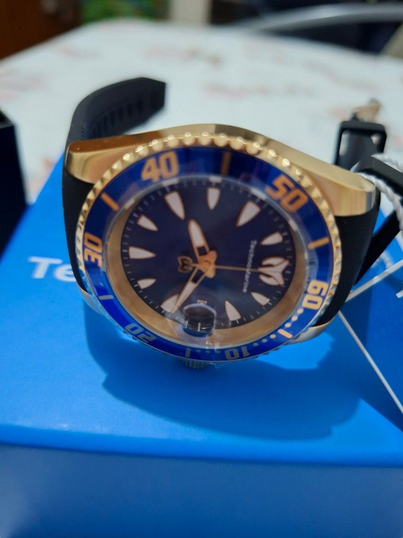 TechnoMarine Gold Plated Watch (Category: Men's Watches) located in Pasay City. Submitted by Tini_winnie (Listing ID 1397909271, Image 2). Description: - TechnoMarine watch - Model: sea manta - Gold-plated case - Blue bezel - Dark blue dial - Gold-tone hands and markers - Black rubber strap - Includes original box - New and unworn - From US - 42mm - mop: gcash or bpi.
