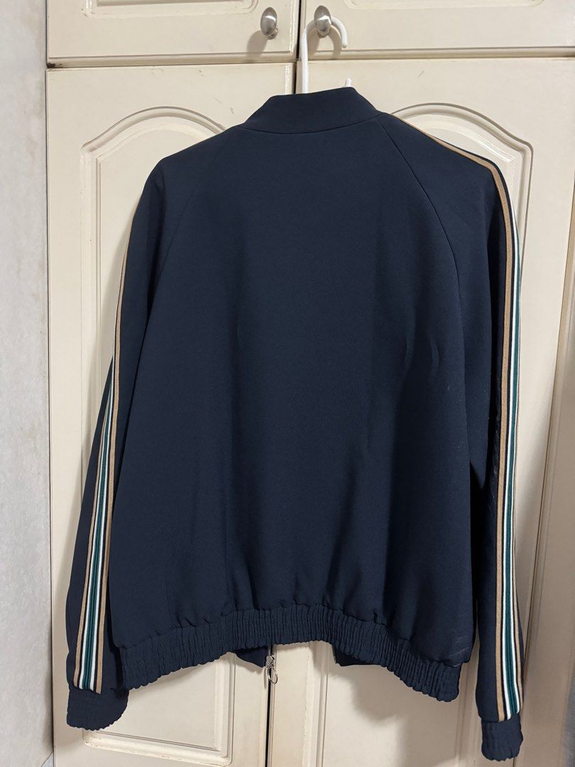 Topman Navy Bomber Jacket (Medium) (Category: Coats, Jackets and Outerwear) located in Las Pinas. Submitted by migoreng320 (Listing ID 1397925173, Image 2). Description: - Topman navy bomber jacket - Size: UK M, EUR 96-101cm, US M - 9/10 condition - Full zip closure - Ribbed cuffs and hem - Striped shoulder detailing - Dark navy lining.