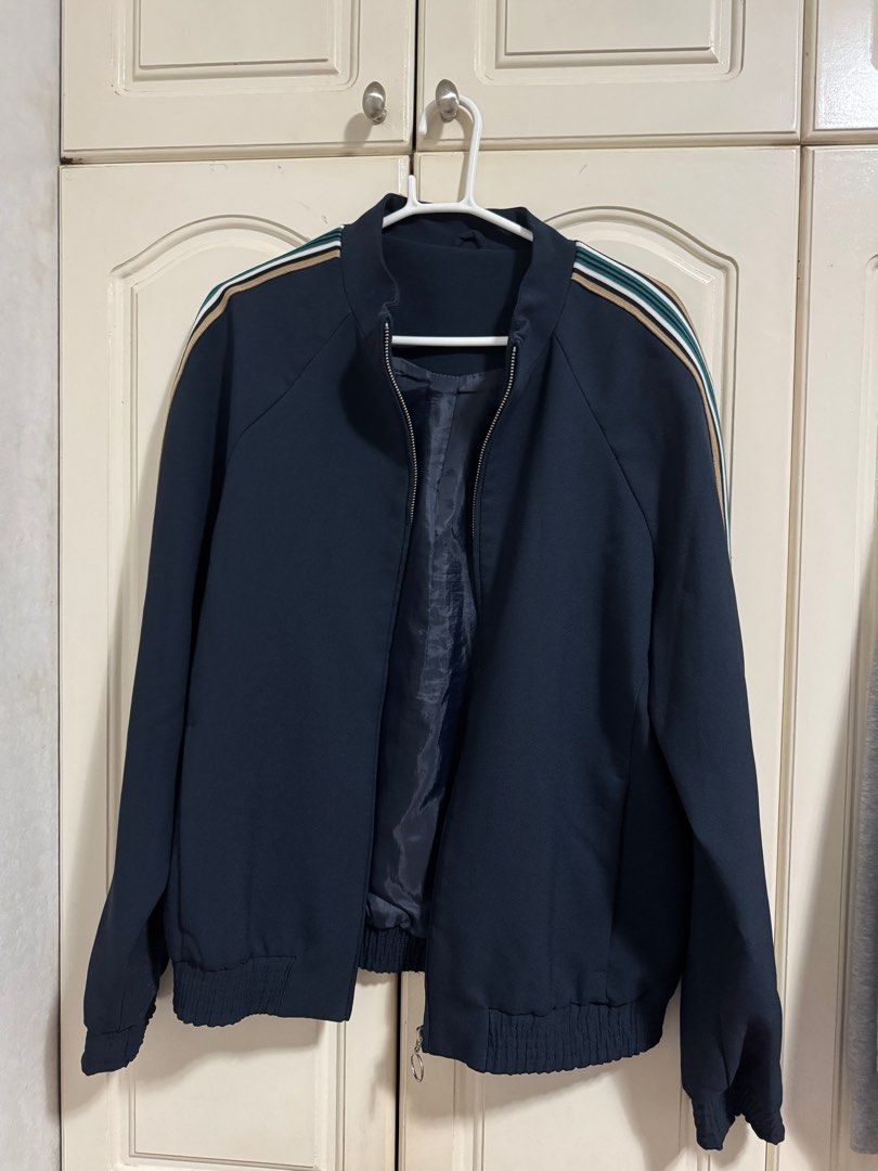 Topman Navy Bomber Jacket (Medium) (Category: Coats, Jackets and Outerwear) located in Las Pinas. Submitted by migoreng320 (Listing ID 1397925173, Image 1). Description: - Topman navy bomber jacket - Size: UK M, EUR 96-101cm, US M - 9/10 condition - Full zip closure - Ribbed cuffs and hem - Striped shoulder detailing - Dark navy lining.