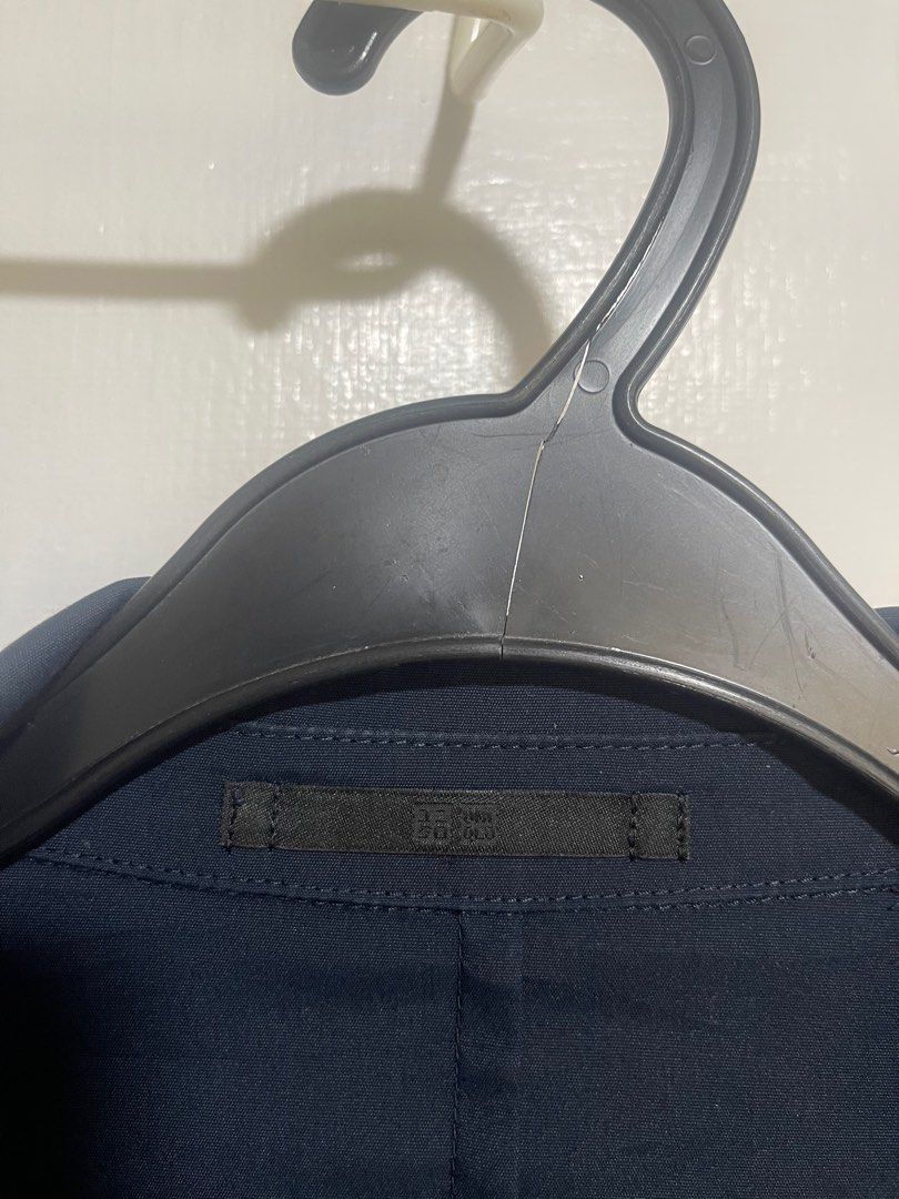Uniqlo Slim Fit Blazer (Category: Formal Shirts) located in Paranaque City. Submitted by twinmanila (Listing ID 1397817867, Image 2). Description: - Uniqlo navy blue blazer - Slim fit - Single-button closure - Two front pockets - Inner pocket - Uniqlo brand tag lightweight.