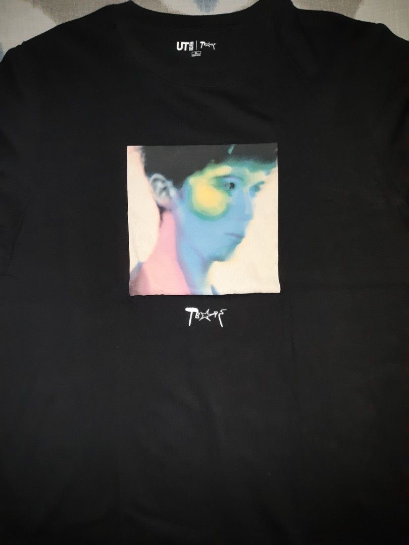 Uniqlo UT T-shirt (Category: Tshirts & Polo Shirts ) located in Las Pinas. Submitted by alanvides (Listing ID 1397795064, Image 2). Description: - Troye Sivan Uniqlo CollabB UT T-shirt - Features a vibrant graphic print - Classic crew neck design - Short sleeves for comfort - Includes artist's name - Uniqlo UT logo present.