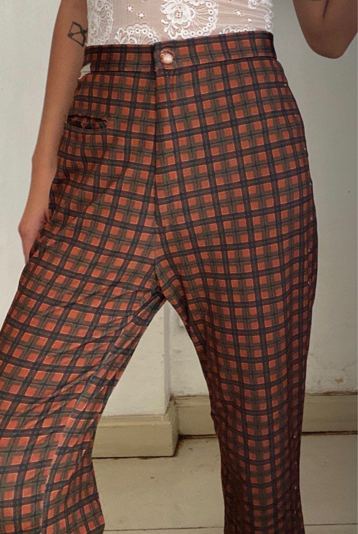 Vintage Plaid Trousers (Category: Trousers) located in Manila. Submitted by raspberryfurs (Listing ID 1397823938, Image 1). Description: - Vintage plaid trousers - High-waisted design - Button closure - Small pocket - Classic brown and orange plaid pattern - Made of sturdy fabric - Perfect for a retro look - Suitable for casual and semi-formal occasions.