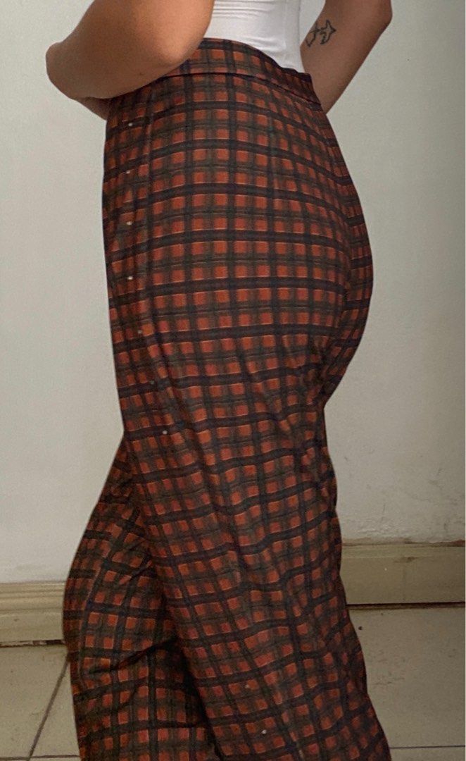 Vintage Plaid Trousers (Category: Trousers) located in Manila. Submitted by raspberryfurs (Listing ID 1397823938, Image 2). Description: - Vintage plaid trousers - High-waisted design - Button closure - Small pocket - Classic brown and orange plaid pattern - Made of sturdy fabric - Perfect for a retro look - Suitable for casual and semi-formal occasions.