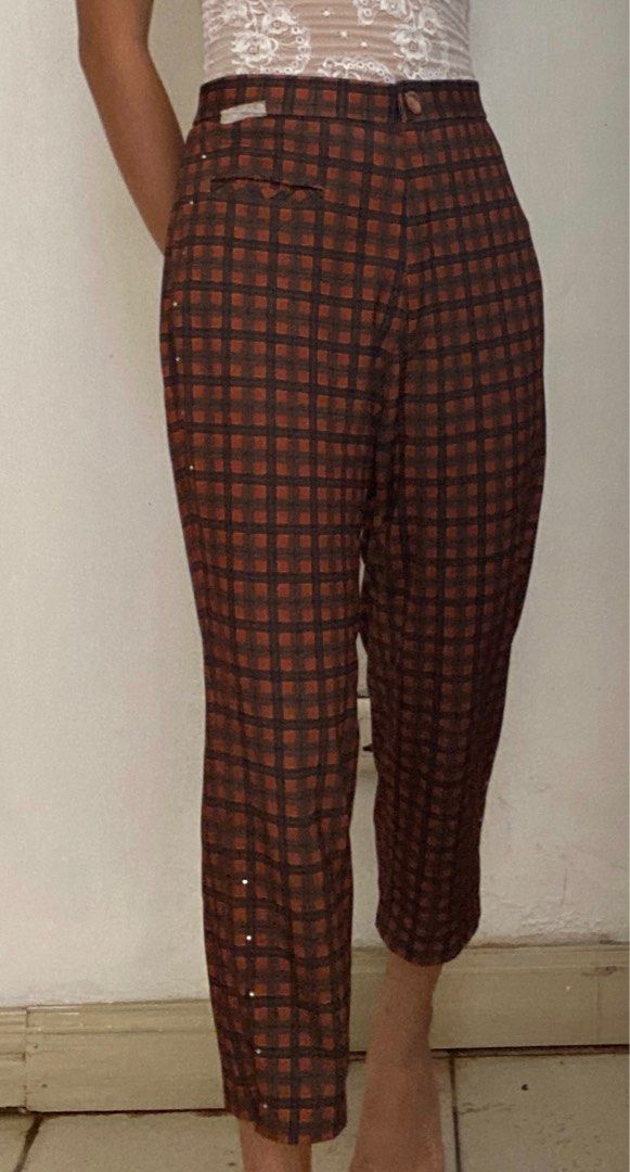 Vintage Plaid Trousers (Category: Trousers) located in Manila. Submitted by raspberryfurs (Listing ID 1397823938, Image 3). Description: - Vintage plaid trousers - High-waisted design - Button closure - Small pocket - Classic brown and orange plaid pattern - Made of sturdy fabric - Perfect for a retro look - Suitable for casual and semi-formal occasions.