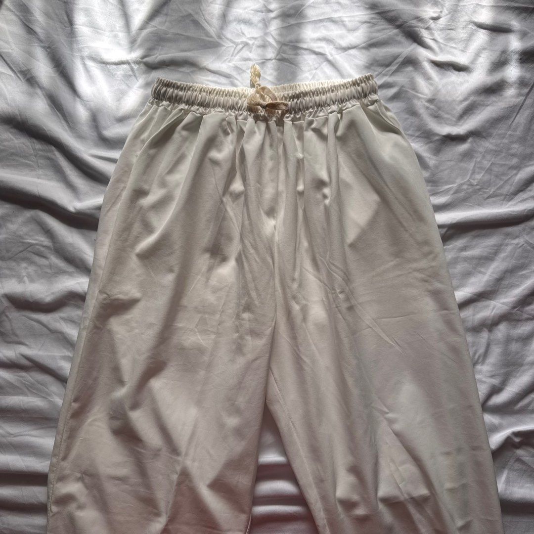 White Drawstring Beach Pants | 27-32 Waist (Category: Other Bottoms) located in Manila. Submitted by helloitsjan (Listing ID 1397843700, Image 3). Description: - White drawstring pants - Relaxed fit - Lightweight fabric - A bit see through - Ideal for beach outfits.