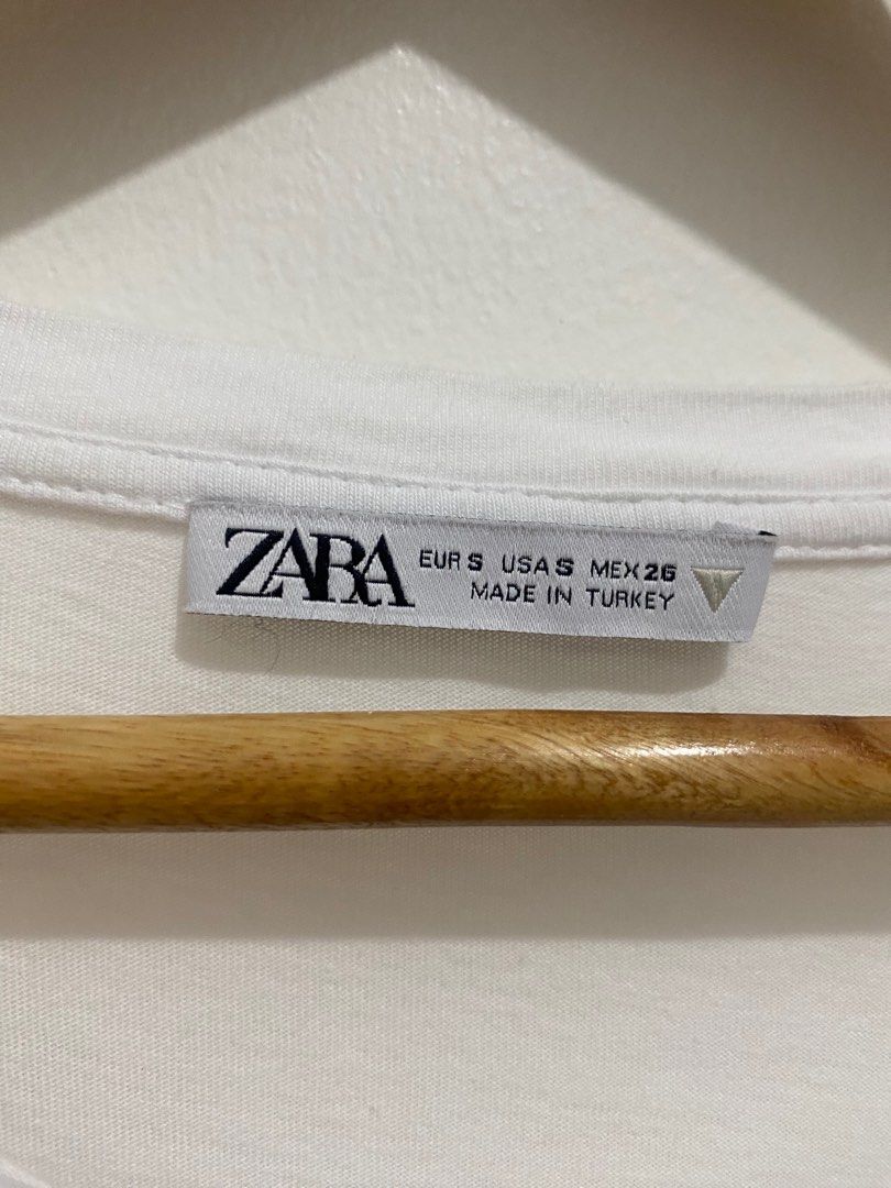 Zara White Eyelet Sleeve Top (Category: Blouses) located in Manila. Submitted by zapitup (Listing ID 1397970387, Image 2). Description: - Zara white top - Eyelet sleeves with floral design - Round neckline - Short, puffy sleeves - Solid white color.
