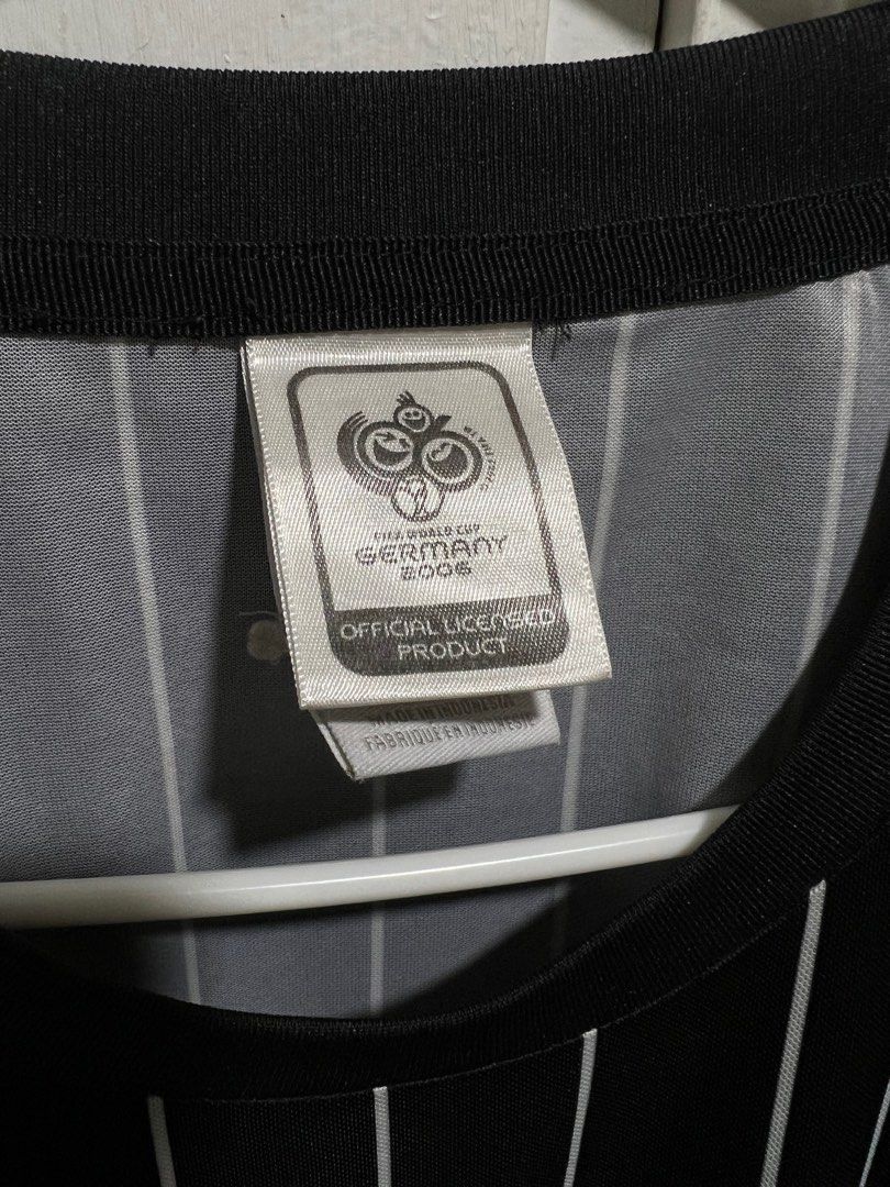 Adidas Germany 2006 World Cup Jersey (Category: Activewear) located in Cebu City. Submitted by tr1balmunk1 (Listing ID 1398130226, Image 2). Description: - Official Adidas Germany 2006 World Cup jersey - Size: XL - Design: Black and white striped - Features: German national team crest, three stars, "deutschland" embroidery on sleeve - Manufacturing: Made in Indonesia - Armpit to Armpit 24" - Length 28".