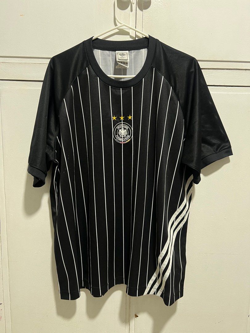 Adidas Germany 2006 World Cup Jersey (Category: Activewear) located in Cebu City. Submitted by tr1balmunk1 (Listing ID 1398130226, Image 3). Description: - Official Adidas Germany 2006 World Cup jersey - Size: XL - Design: Black and white striped - Features: German national team crest, three stars, "deutschland" embroidery on sleeve - Manufacturing: Made in Indonesia - Armpit to Armpit 24" - Length 28".