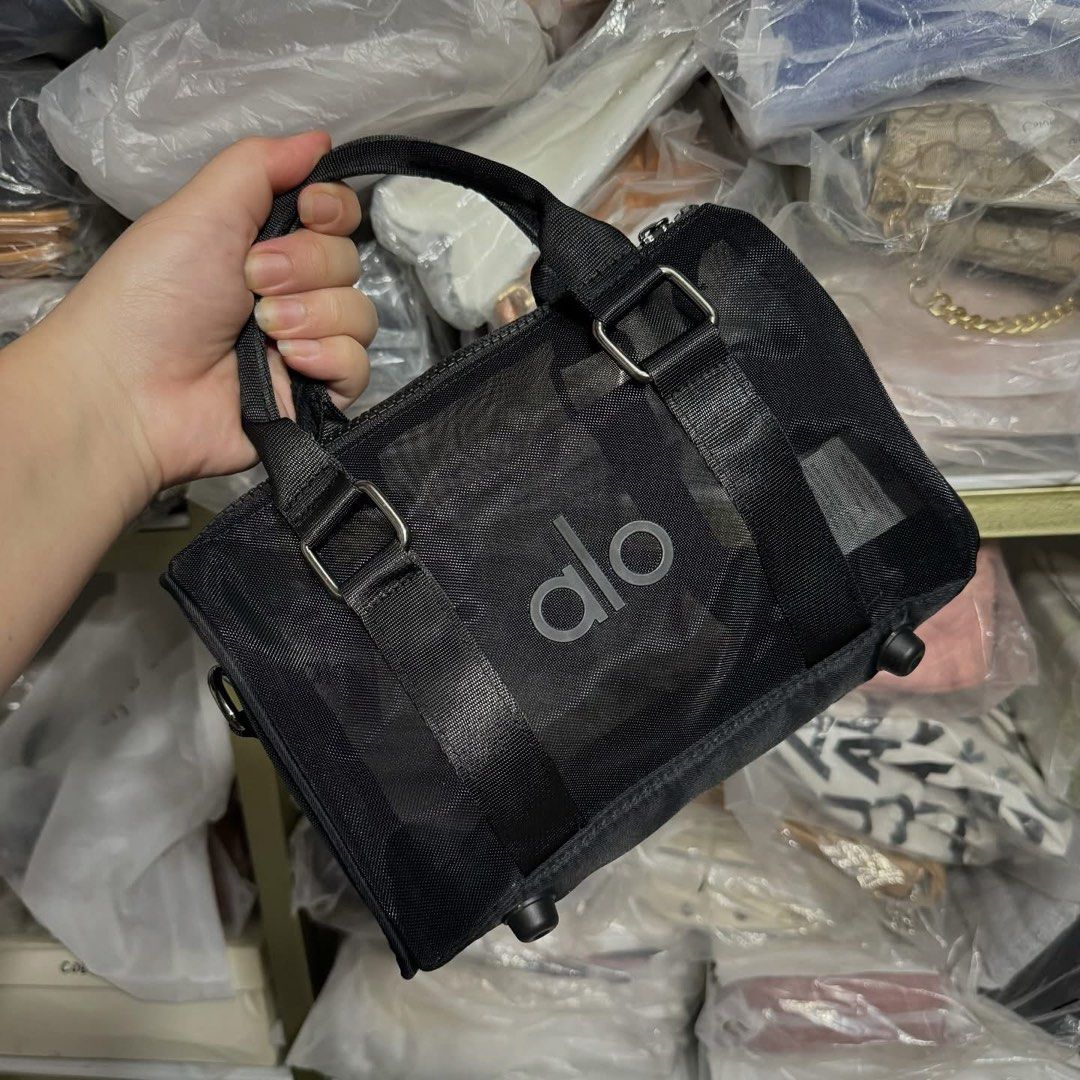 Alo Sheer Duffle Bag (Category: Cross-body Bags) located in Pasig City. Submitted by whimsy.finds (Listing ID 1398055757, Image 2). Description: Small Size: 23cm x 14cm x 7.5cm Less ₱40 min 6ps and up (free sf) Payment first via Gcash Ship via Lalamove / J&T Loc: Malolos Bulacan .