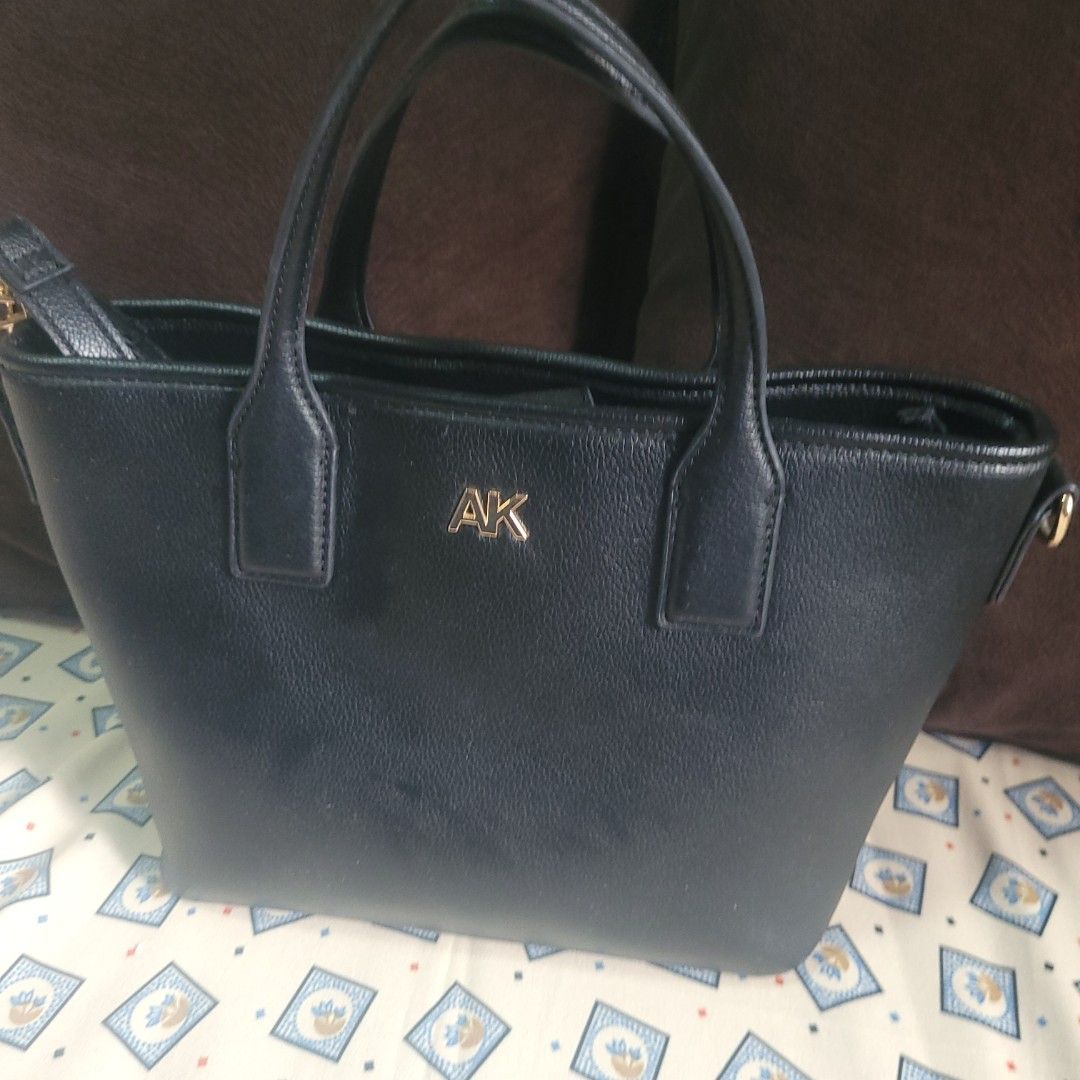 Anne Klein Black Handbag with Wallet (Category: Luxury Bags & Wallets) located in Bulacan. Submitted by butterflym60701 (Listing ID 1397999987, Image 1). Description: - Black Anne Klein handbag with matching wallet. - Gold-tone "AK" logo on the front. - Detachable shoulder strap included. - Interior features a zippered pocket and Anne Klein logo lining. - Top handles and gold-tone hardware. - Matching wallet with zipper closure..