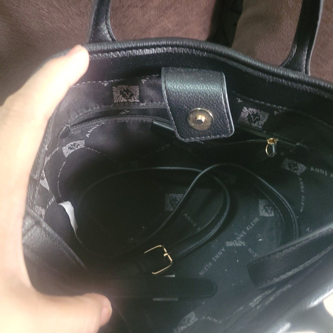 Anne Klein Black Handbag with Wallet (Category: Luxury Bags & Wallets) located in Bulacan. Submitted by butterflym60701 (Listing ID 1397999987, Image 3). Description: - Black Anne Klein handbag with matching wallet. - Gold-tone "AK" logo on the front. - Detachable shoulder strap included. - Interior features a zippered pocket and Anne Klein logo lining. - Top handles and gold-tone hardware. - Matching wallet with zipper closure..