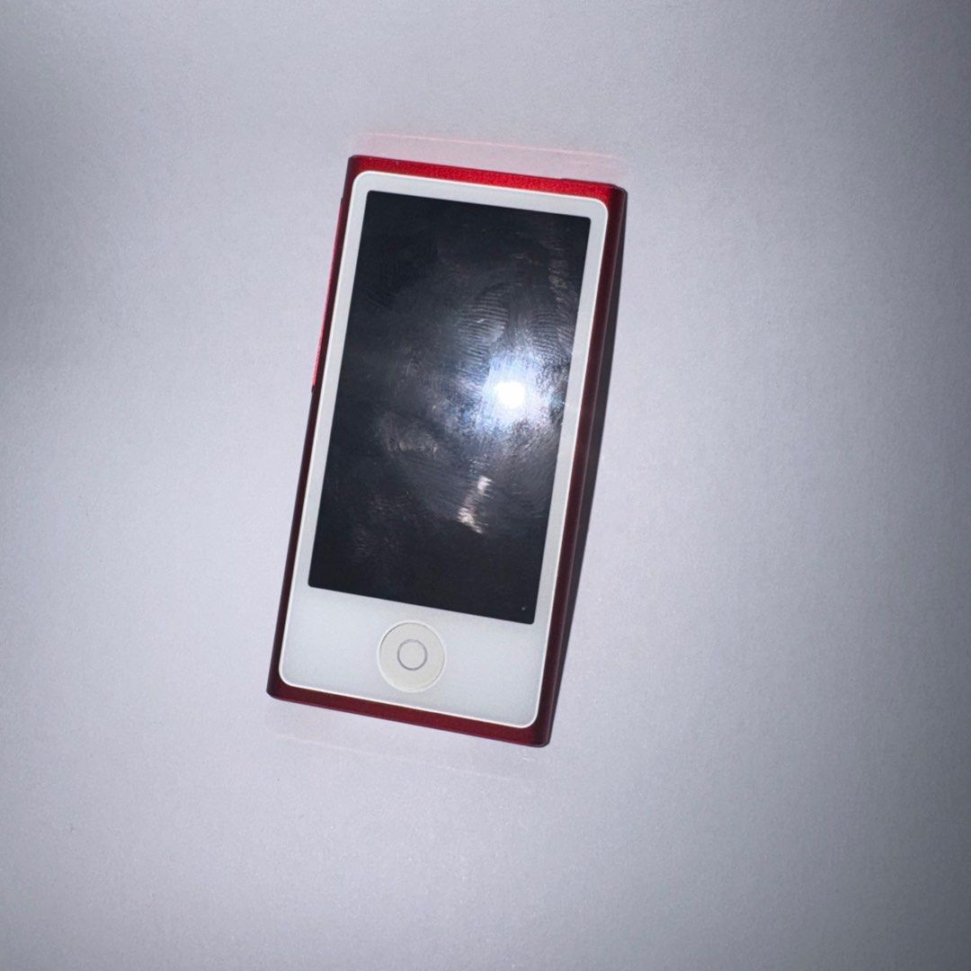 Apple iPod Nano Red Product Red (Category: Portable Music Players) located in Mandaluyong City. Submitted by username_optional (Listing ID 1398105180, Image 2). Description: - Red Apple iPod Nano - Color display - Displays clock and settings - Apple logo and iPod branding on the back - In good working condition - Has custom engraving on the back - as is what you can see - unit only no other inclusions UNIT ONLY There are some flaws on detailing b