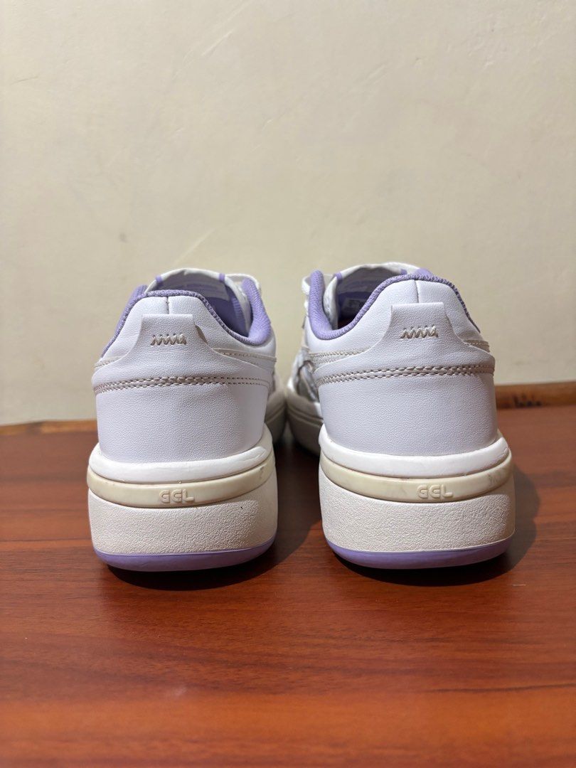 Asics Janapn S ST Purple Sneakers (Category: Sneakers) located in Aparri. Submitted by lpenny (Listing ID 1398097327, Image 2). Description: - Asics GEL-NYC sneakers - Color: White upper with purple accents - Size: US 8 / EUR 42.5 / 27.0 cm - Features: Lace-up closure, Asics logo - Condition: Good soles.