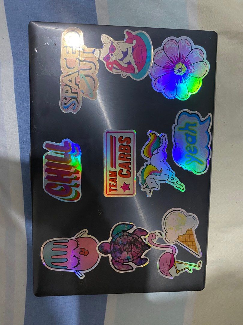 ASUS Laptop with Stickers (Category: Laptops & Notebooks) located in Manila. Submitted by eli024 (Listing ID 1398128366, Image 1). Description: - ASUS laptop with stickers on lid and keyboard area. - Silver finish on the bottom. - Standard keyboard layout. - Black screen. - In working condition. - Features a Windows 8 sticker..