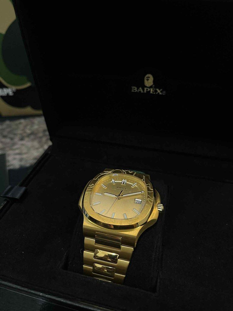 Bapex Type 10 All Gold Watch (Category: Luxury Watches) located in Dumaguete. Submitted by infiniteloot_ (Listing ID 1398110939, Image 1). Description: Check out this stunning Bapex Type 10 All Gold watch! It's brand new and ready to elevate your style. The all-gold design is super eye-catching, and the details are just amazing. This watch is perfect for any occasion, whether you're dressing up or keeping it casual. DM me if you're interested!.