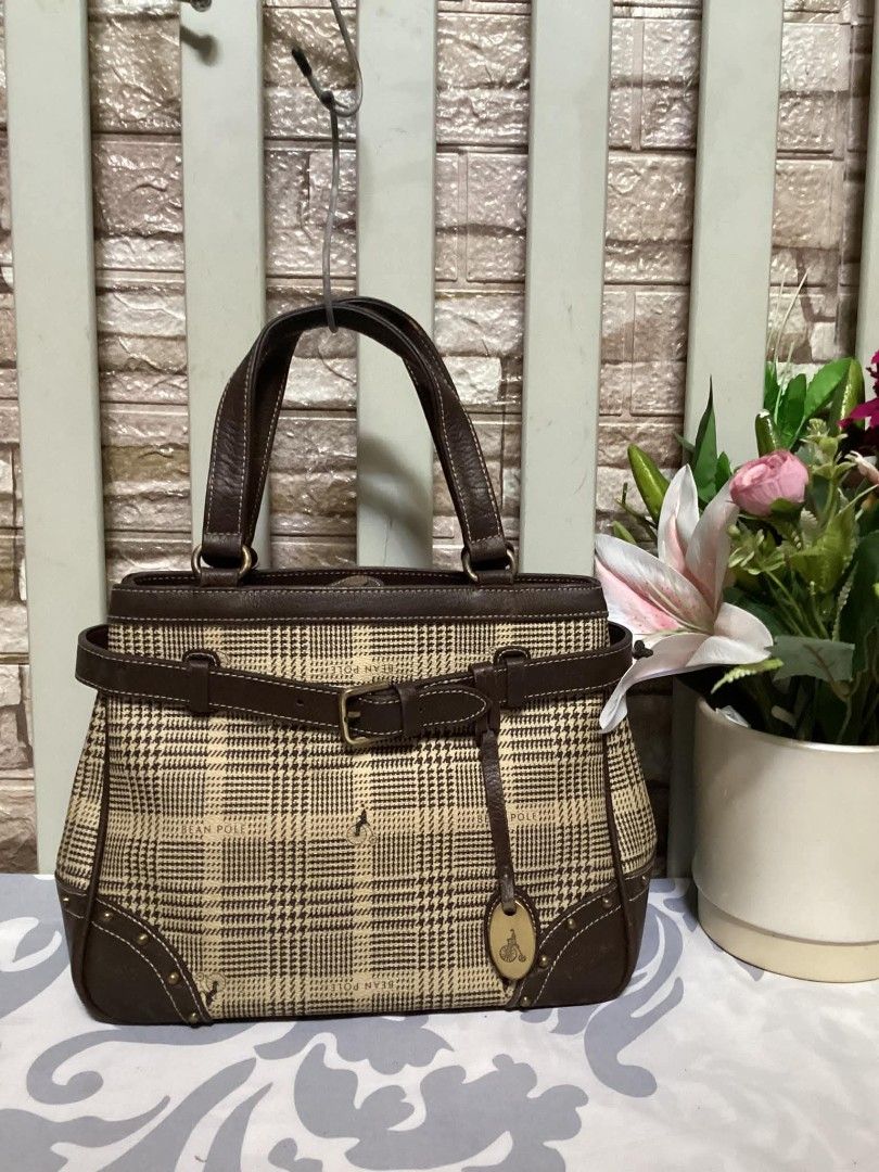 Bean Pole Handbag (Category: Luxury Bags & Wallets) located in Santa Rosa. Submitted by ahroncatpad (Listing ID 1398082773, Image 1). Description: - Plaid pattern handbag - Brown leather accents - Dual handles and adjustable strap - Interior zippered pocket - Bean Pole label and logo tag - Protective metal studs on the base.