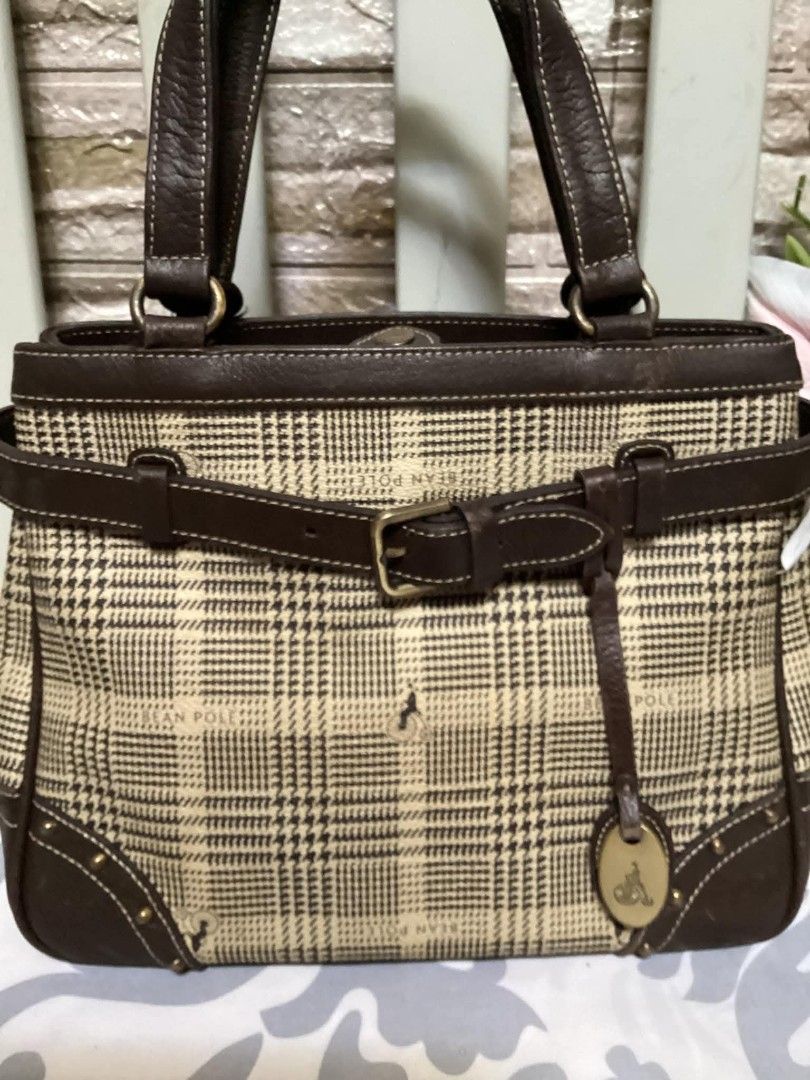Bean Pole Handbag (Category: Luxury Bags & Wallets) located in Santa Rosa. Submitted by ahroncatpad (Listing ID 1398082773, Image 2). Description: - Plaid pattern handbag - Brown leather accents - Dual handles and adjustable strap - Interior zippered pocket - Bean Pole label and logo tag - Protective metal studs on the base.