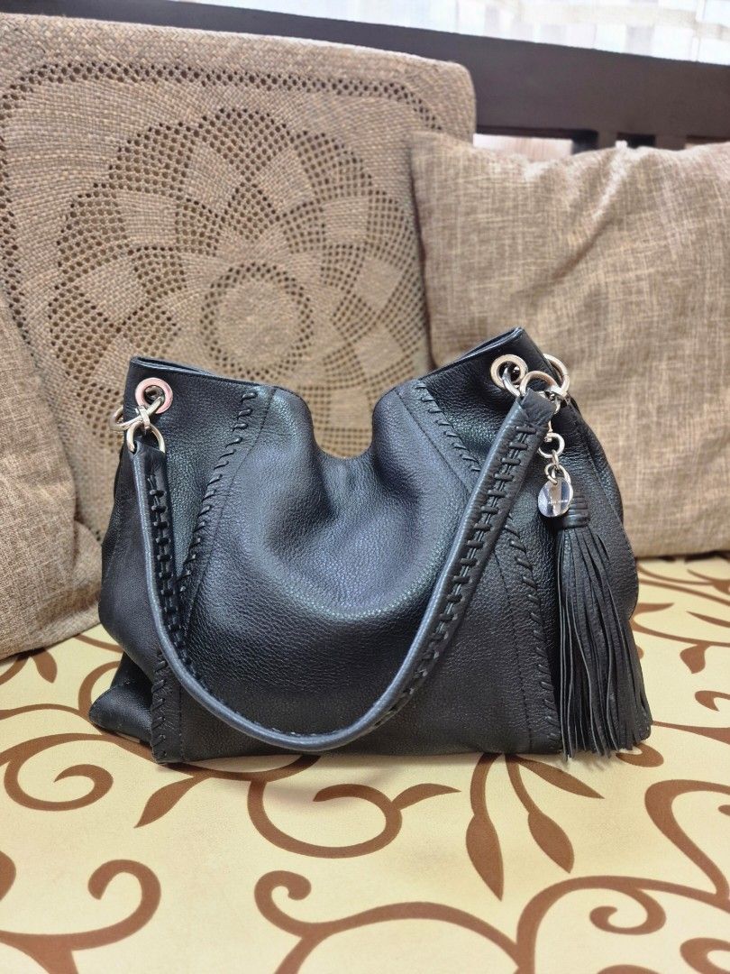 Black Leather Hobo Bag with Tassel (Category: Shoulder Bags) located in Quezon City. Submitted by jermiahh (Listing ID 1398023563, Image 1). Description: - Black leather hobo bag - Braided strap - Silver-tone hardware - Tassel detail - Zipper closure - Slouchy design - Soft leather.