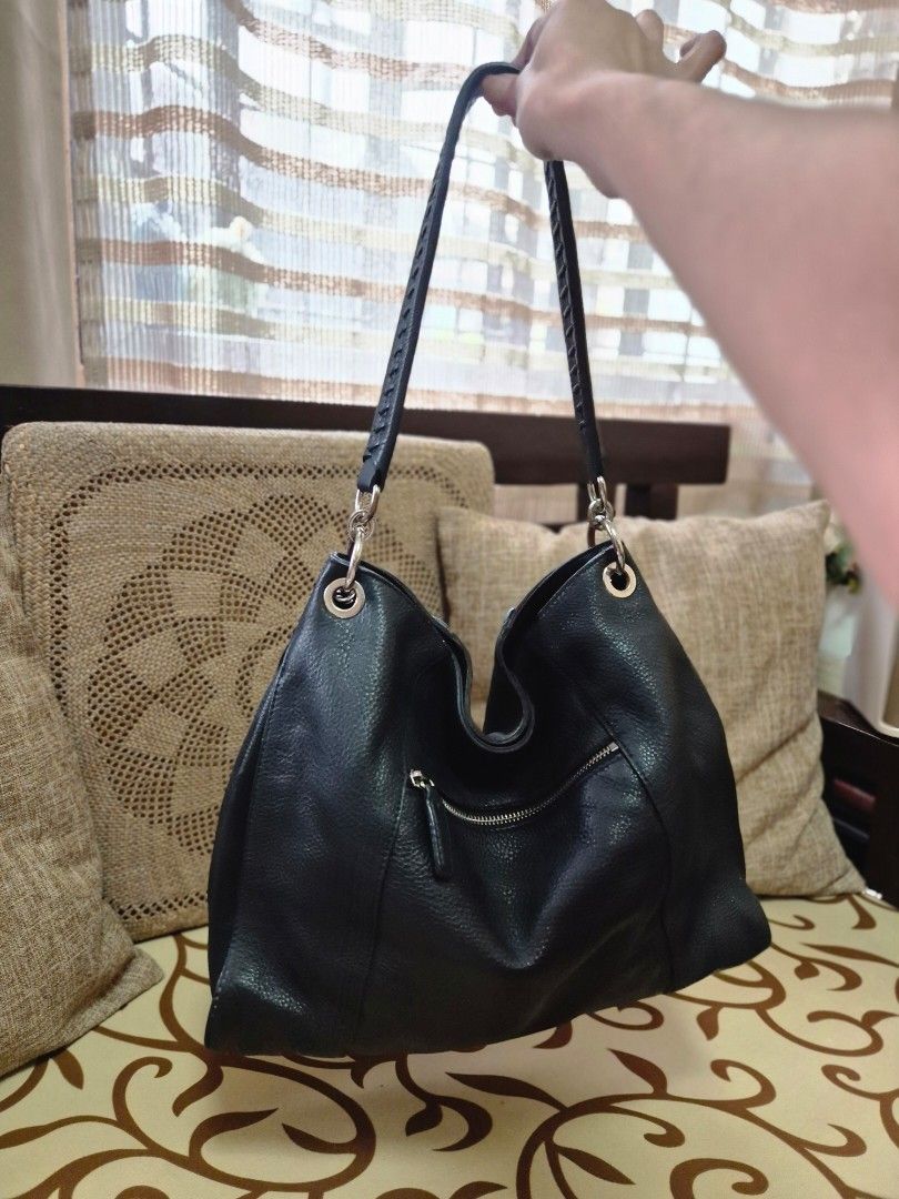 Black Leather Hobo Bag with Tassel (Category: Shoulder Bags) located in Quezon City. Submitted by jermiahh (Listing ID 1398023563, Image 3). Description: - Black leather hobo bag - Braided strap - Silver-tone hardware - Tassel detail - Zipper closure - Slouchy design - Soft leather.