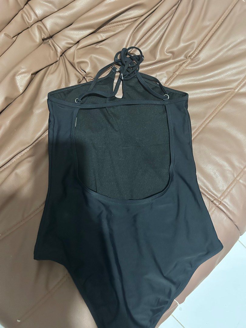 Black One-Piece Swimsuit (Category: Bikinis & Swimsuits) located in Quezon City. Submitted by _judebbr1 (Listing ID 1398057275, Image 2). Description: - Black one-piece swimsuit - Halter neck design - Keyhole detail at the front - Open back - Smooth, solid fabric - Simple and classic style - Perfect for swimming or lounging Got it from SM dept store, worn only once..
