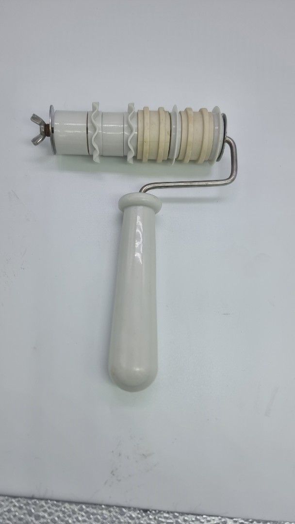 Ceramic Roller with Handle (Category: Bakeware) located in Marikina City. Submitted by andreah_16 (Listing ID 1397990827, Image 1). Description: - Ceramic roller - White handle - Metal frame - Wingnut included - Designed for shaping/smoothing - Comfortable grip.